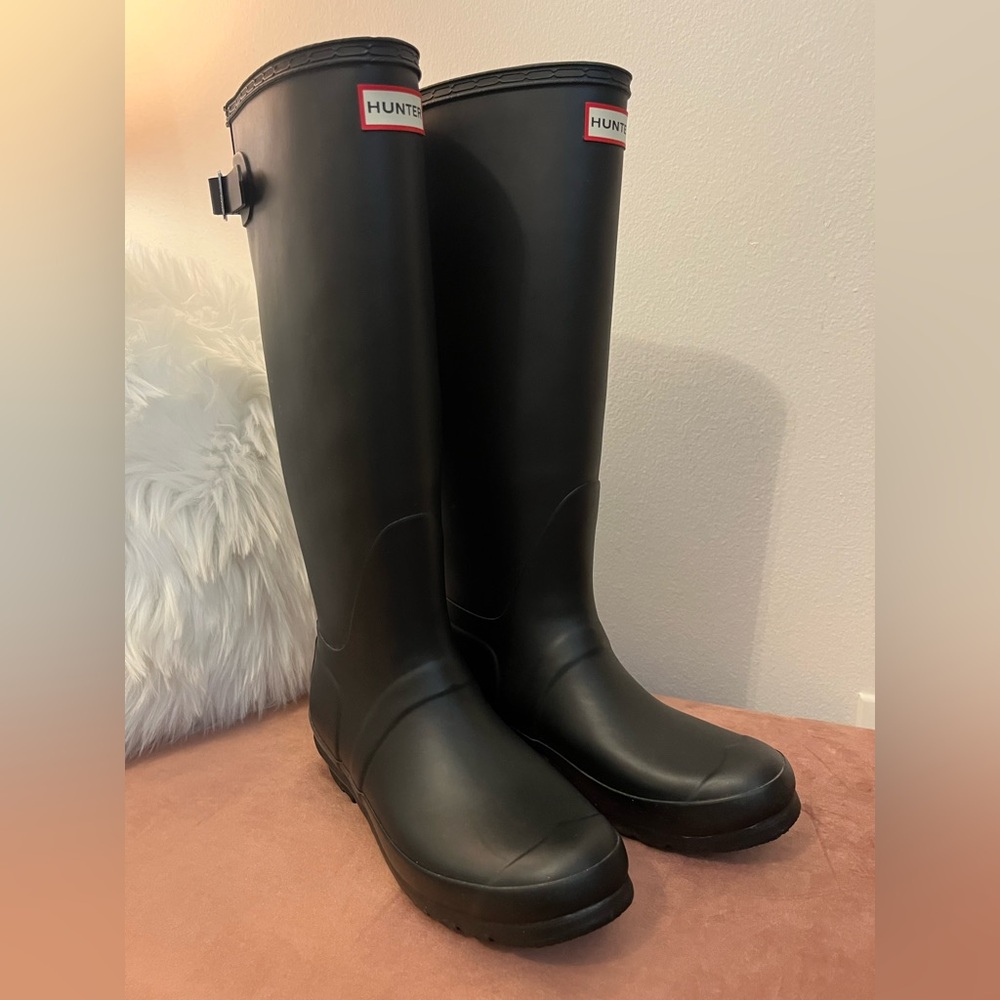 Hunter boots in black and off white knit socks. Original boxes included.
